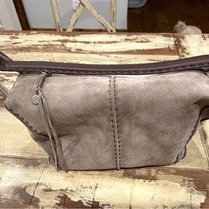 This is a new Sak purse (no label), grey suede, perfect condition. Great size!